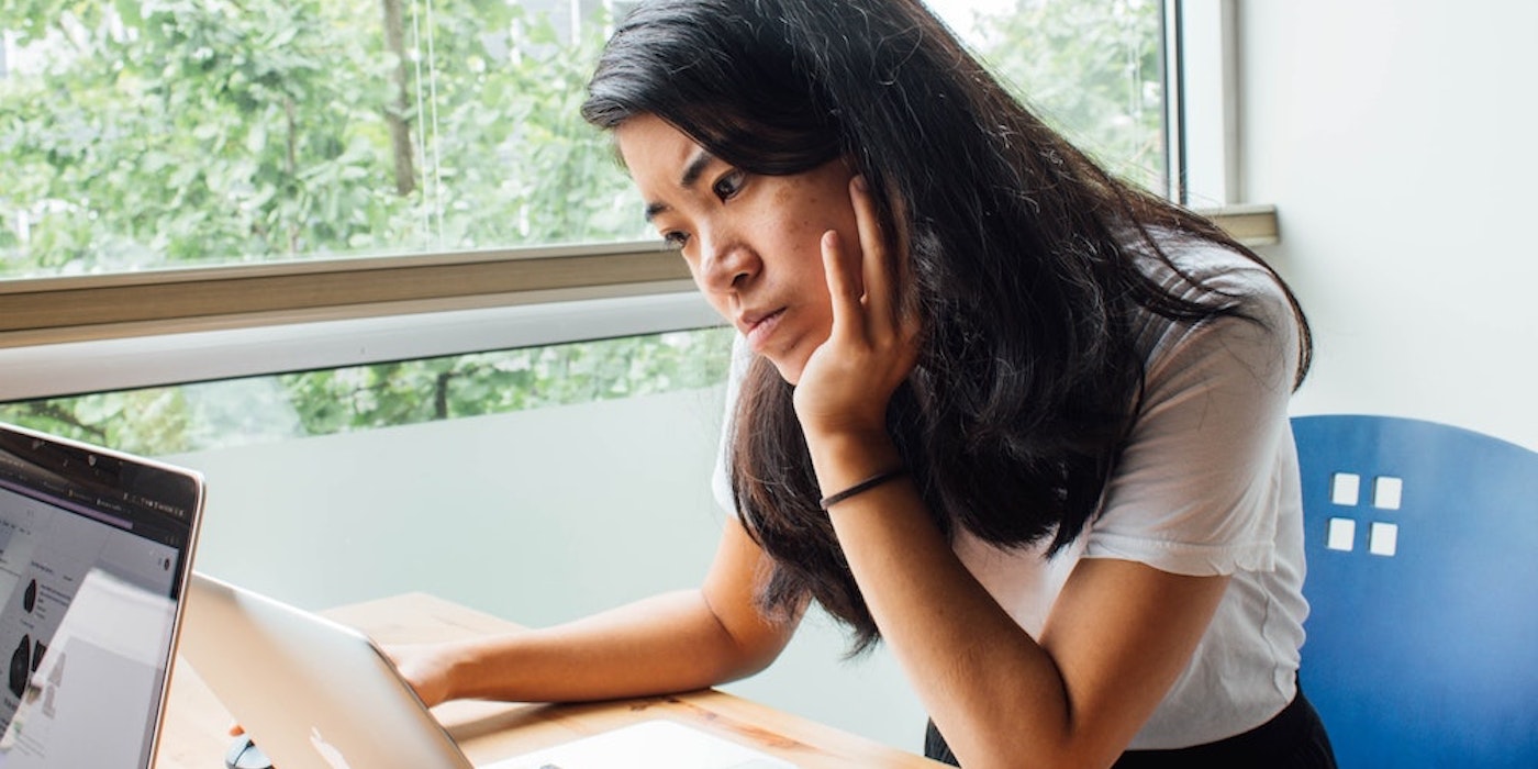 Online MBA student working at laptop computer