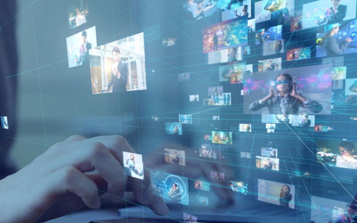 A closeup of hands maneuvering around a computer screen filled with pictures of innovative solutions.